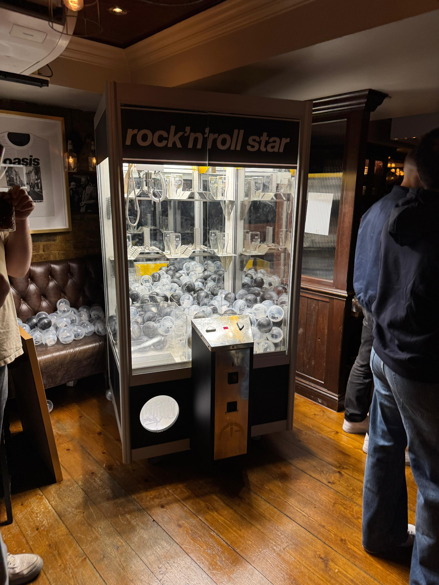 Prize claw arcade machine hire installed at a branded pub event