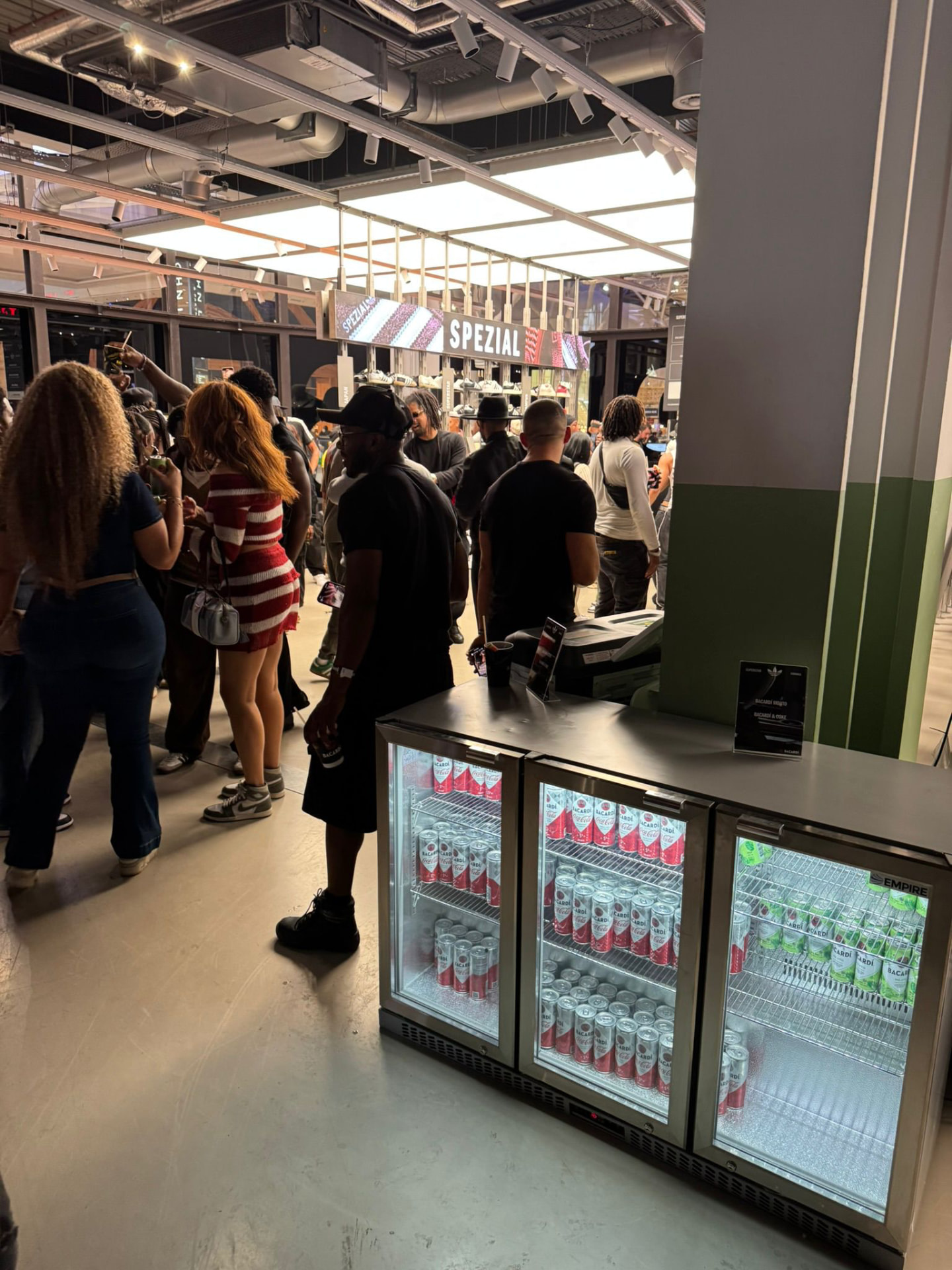 Triple glass door bottle coolers serving a busy event crowd